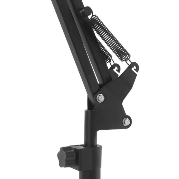 Détail du ressort de tension sur le bras de la lampe à lumière rouge et infrarouge